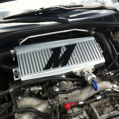 Mishimoto MMTMIC-WRX-01SLBK Top-Mount Intercooler Compatible With Subaru WRX/STI 2001-2007 Silver Cooler, Black Hose - color: Silver Cooler, Black Pipes